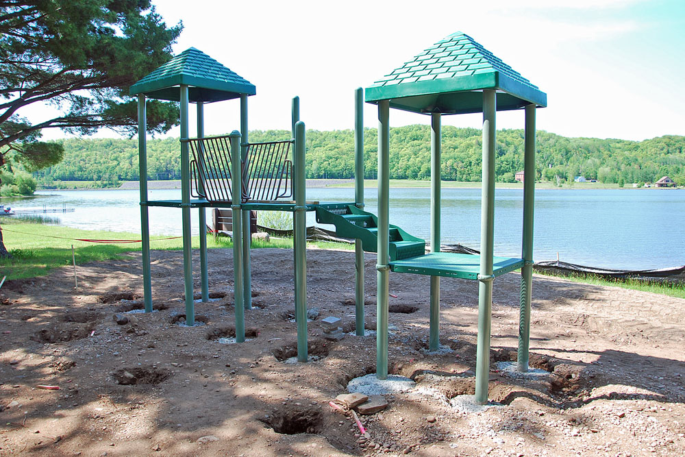 With a generous donation from the Rotary Club, and other interested parties, new playground equipment was made available for the Hancock Beach. City personnel and volunteers took the equipment, which came totally disassembled, laid it all out, put in the concrete pads, and assembled the set.