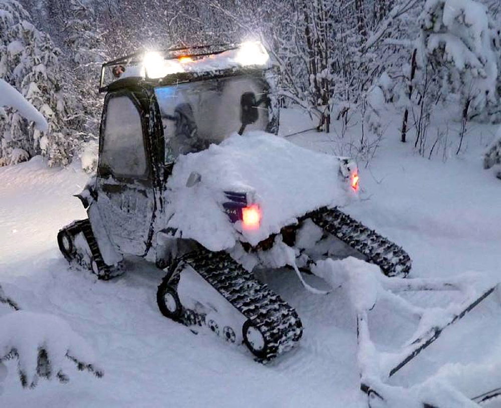 Arlyn Aronson, Groomer Operator for the Keweenaw Nordic Ski Club, makes his way on a solo mission to groom the trails, day or night, during evenst or after significant snowfalls.