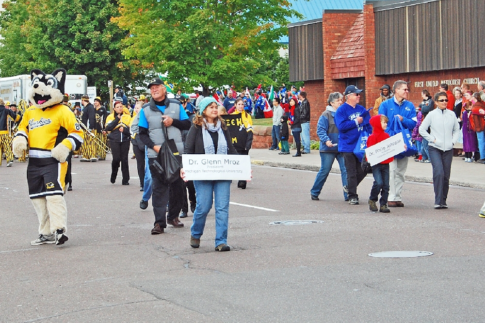 Leading off is MTU President Dr. Glenn Mroz (L), amd FU President Dr. Phillip Johnson (right with blue jacket) and his wife.