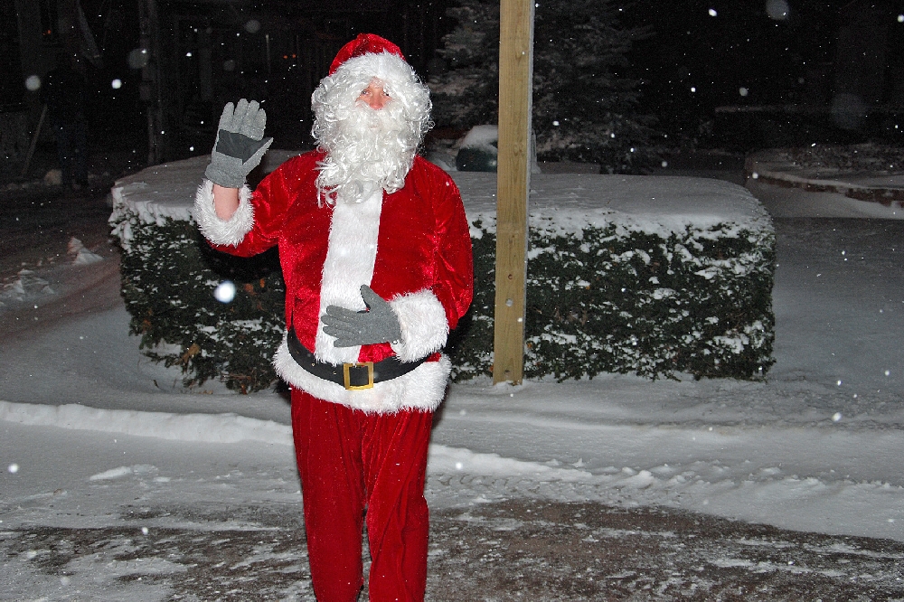 The Annual Christmas Walk through downtown Hancock, brought a visit from Santa Claus, along with the Hancock VFD Fire Truck to lead the Parade. Santa hitched a ride after arrving from the North Pole via sleigh, and was dropped off at City Hall for the tree lighting ceremony.