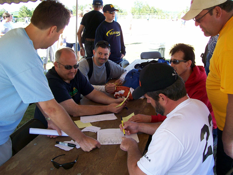 Tournament officials on Saturday set up the schedule, and do the drawing for playoff assignments. The weather was perfect. Guts Frisbee started in Eagle Harbor, MI in 1958, by a group of Eagle Harborites headed up by the Healy family. Brothers Tim and Pete Healy would die tragically, along with a brother-in-law John Caspary, during deer season of 1968, in a drowning mishap at Twin Lakes.