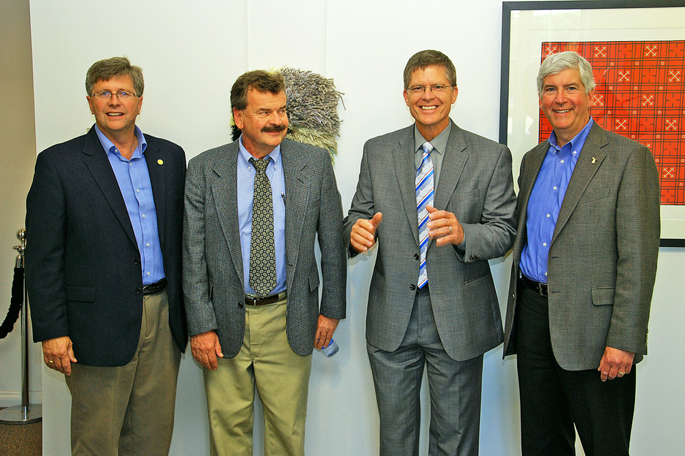 Pausing for a light hearted moment with our photographer, before entering the Finlandia University Finnish American Heritage Center, is left to right: MI State Senator Tom Casperson; Hancock Mayor Bill Laitila; Finlandia University President Dr. Phillip Johnson; and MI Governor Rick Snyder.