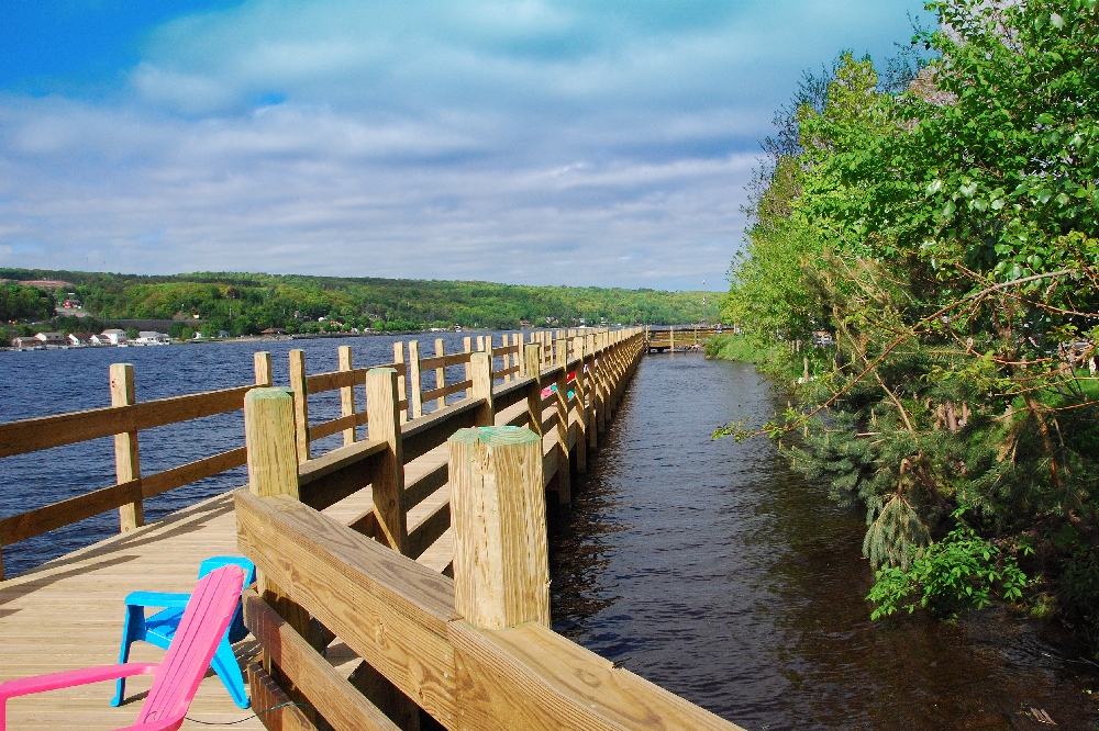 The new Boardwalk on a beautiful June morning. The boardwalk is 362 feet long, and 10 feet wide, is handicap accessible for walking, fishing, sightseeing, and boat mooring.