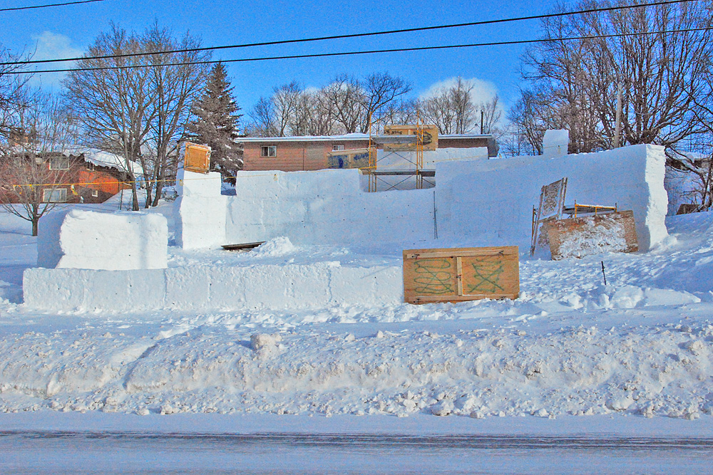 With the return to school following the Holidays, work gets under way on the Winter Statue building for MTU�s winter Carnival.  The theme this year is �COME TO LIFE IN FROSTY WAYS, NOSTALGIC FILMS OF CHILDHOOD DAYS�. Snowfall was bountiful this year, unlike some recent years, but dangerously low chill temperatures caused some lost construction time, as safety concerns by MTU brought construction to a halt at times. Hancock�s PKT Fraternity got under way in the major category, as is shown in the week preceeding the week of Carnival.