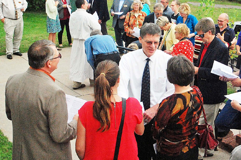 FU President, Dr. Phillip Johnson, chats with the Isaacson Family prior to the beginning of the Dedication.