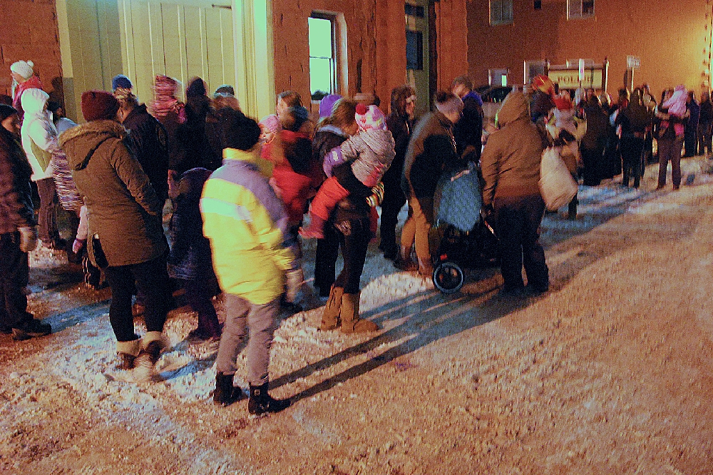 A good crowd gathered to await the arrival of Santa, who was brought into town as a special guest on the Volunteer Fire Department Pumper Truck.