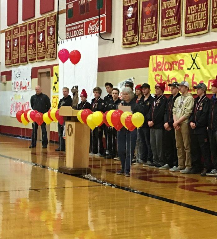 Mayor Lisa McKenzie congratulating the Bulldogs for winning the Division 3 State boys ice
hockey state champions.