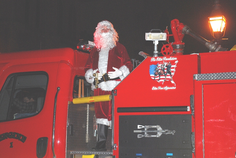 Santa is feted with a tour through town on a City Fire Truck, finally arriving at City Hall/Montezuma Park.