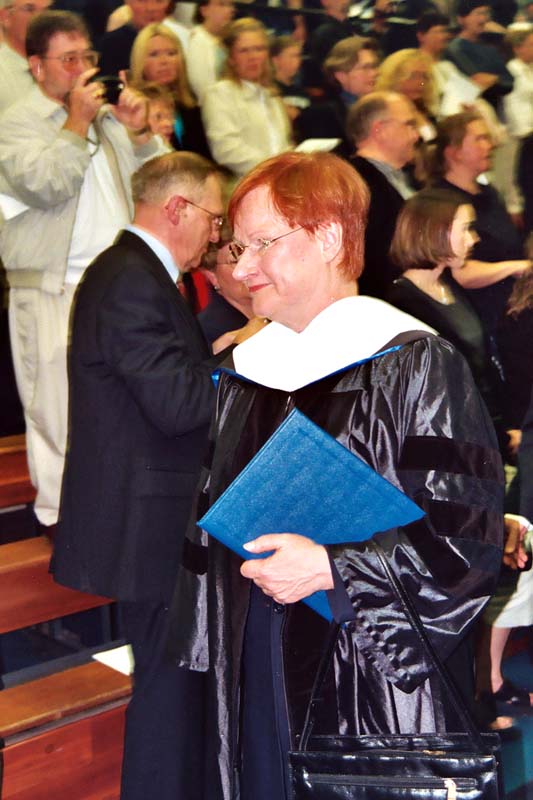 The Honorable Tarja Halonen, arrived in Hancock Sunday morning, April 27th , 2003, for the beginning of a two day visit. The only other time a Finish President visited the area was Pres. Kekkonen on August 1, 1976. While her primary agenda was to attend and deliver Finlandia University�s Commencement address, she also made other appearances in the area, under tight security.  As President Halonen entered the Paavo Nurmi Center, a packed crowd took photos for scrapbooks..