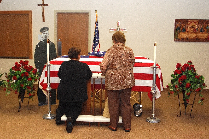 The remains of Gerald Lehman (18 years of age at the time), lie in State at Hancock�s Church of the Resurrection prior to a Memorial Service on June 12, 2010. His remains were finally identified by mitochondrial DNA found on envelope flaps of letters sent home prior to that fatal day.