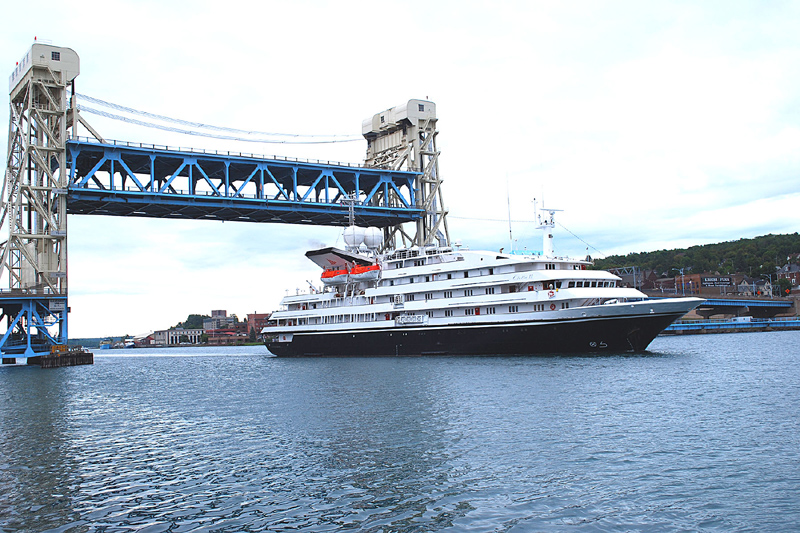 Constructed in 1958 & 1959, the Portage Lake Lift Bridge opened to traffic in October, 1959, with the the 50th Anniversary being celebrated this year. Here, the cruise ship Clelia II, of Toronto, Canada, makes a port call in Hancock/Houghton last summer.